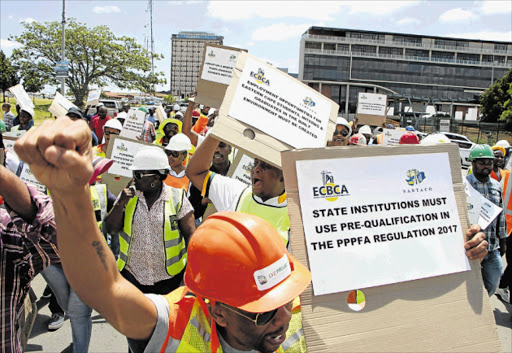 UNHAPPY: Eastern Cape contractors and consultants marched from Bhisho stadium to the legislature to hand over a memorandum of demands to premier Phumulo Masualle Picture: SISIPHO ZAMXAKA