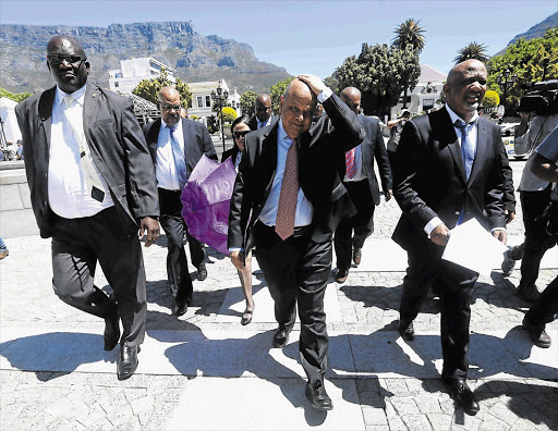 DEAD MAN WALKING? Finance Minister Pravin Gordhan on his way to delivering his mini-budget speech last year