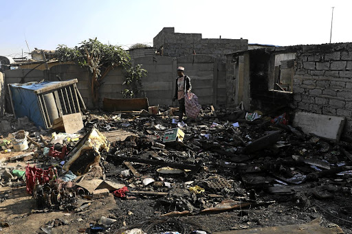 Foreign nationals were chased away and their shacks burnt in Vusimuzi, Tembisa, on Wednesday night. / Thulani Mbele