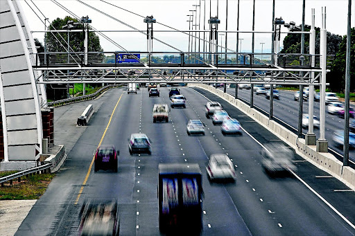 PAY AS YOU DRIVE: An e-toll gantry on the N1 highway in Joburg. The disputed system is expected to come into operation next month in a cheaper form to motorists Photo: HALDEN KROG