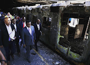 Transport minister Fikile Mbalula on Thursday visited Cape Town station following the burning of 18 train carriages in the early hours of the morning.