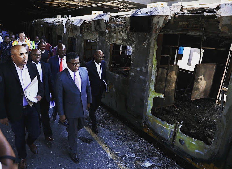 Transport minister Fikile Mbalula on Thursday visited Cape Town station following the burning of 18 train carriages in the early hours of the morning.