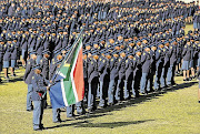 Police graduates hold their passing-out parade at Vygieskraal Stadium near Athlone yesterday. The 1926 officers were trained at the Bishop Lavis and Philippi police academies and 1324 of them will join the Western Cape SAPS. Their basic development programme included dealing with crowd management and a workshop on the Electoral Act in readiness for next month's local elections