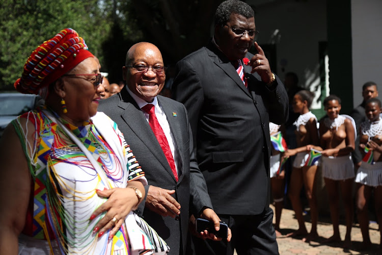 Former president Jacob Zuma arrives at the opening of the KwaZulu-Natal legislature in Pietermaritzburg flanked by Weziwe Thusi and Meshack Radebe.