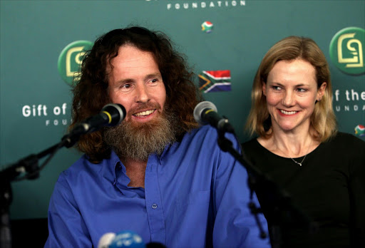 Stephen McGown seated next to his wife Catherine, speaks at a press conference at the Gift of the Givers in Johannesburg. He was released by al-Qaeda after being held hostage in Mali for six years. / Alon Skuy.