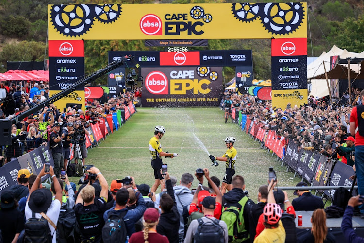 South Africa's Matthew Beers (left) and Toyota-Specialized-NinetyOne partner Howard Grotts of the US celebrate their overall victory in the 2024 Absa Cape Epic at the finish at Coetzenburg Athletics Stadium on Stellenbosch on Sunday.