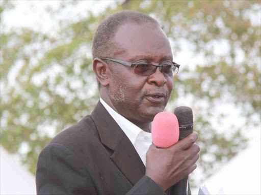 Dr. Michael Amollo during the burial of his wife Monica on February 22, 2015. He died after being stabbed by his son.Photo/Habil Onyango