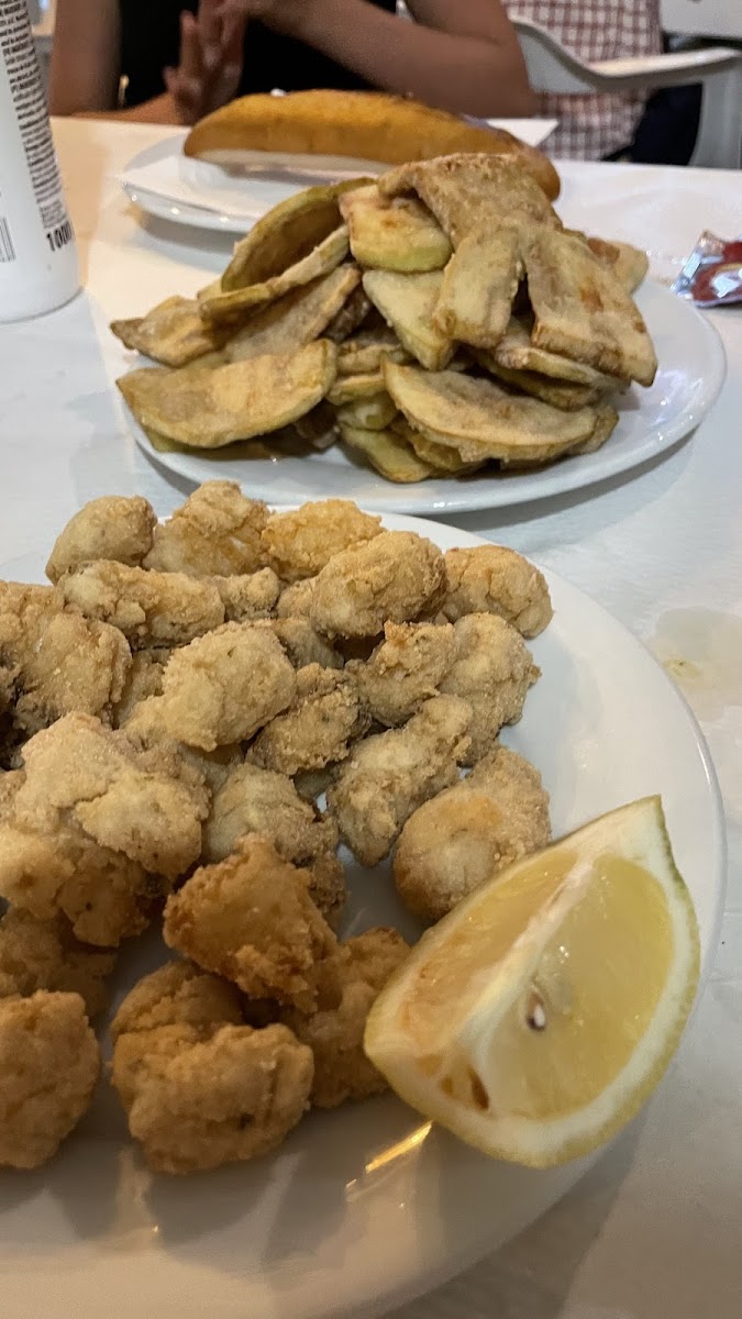 fried fish and in the background fried eggplant