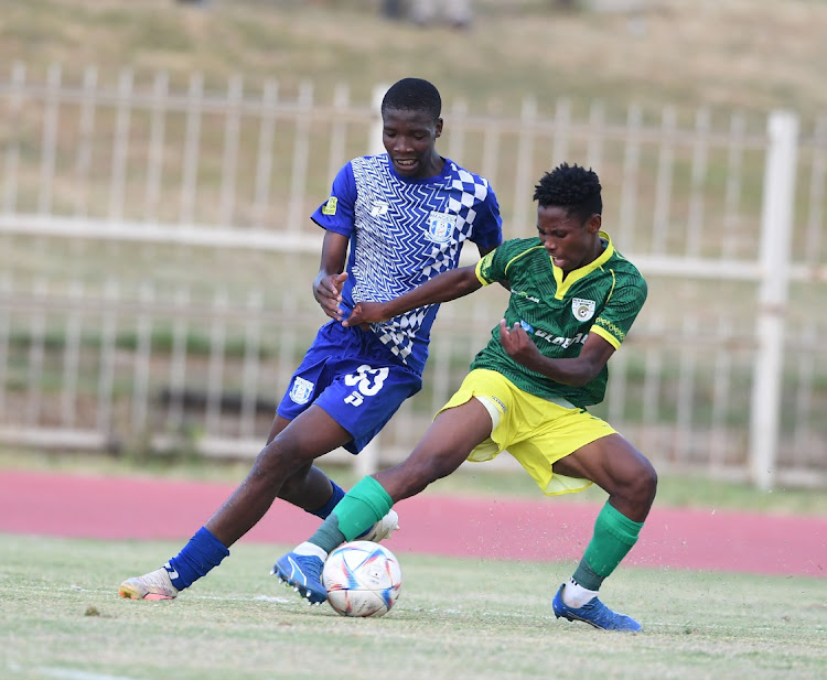 Tshepo Mashigo of Magesi FC and Boy Madingwana of Baroka FC during the Motsepe Foundation Championship match between Magesi FC and Baroka FC at Old Peter Mokaba Stadium in Polokwane