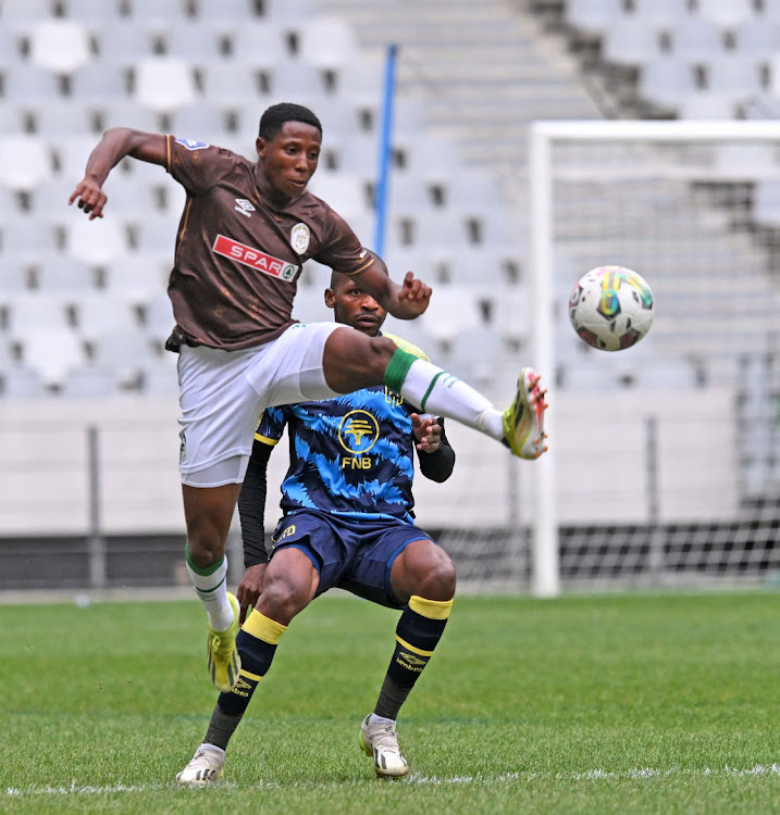 Tshepang Moremi of AmaZulu is challenged by Thamsanqa Mkhize of City yesterday.