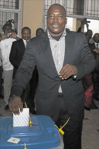 HOPEFUL: Incumbent Congolese President Joseph Kabila casts his ballot in the Democratic Republic of Congo's capital Kinshasa on Monday. photo: REUTERS