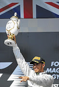 Mercedes' Lewis Hamilton won the Hungarian Grand Prix for the fourth time yesterday