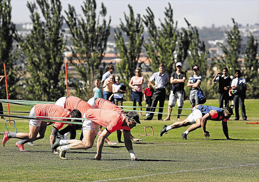 WEIGHTY MATTERS: Onlookers watch the Springboks train at St Peter's College in Johannesburg yesterday. Hooker Bismarck du Plessis has made the starting team to face New Zealand in the last round of the Rugby Championship at Ellis Park on Saturday