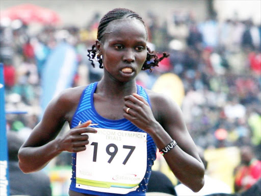Kenyan athlete Vivian Cheruiyot sprints to the finish line during the 2016 Rio Olympics trials in Kenya's North Rift Valley town of Eldoret, June 30, 2016.