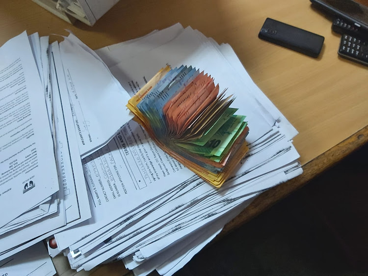 Metro police officers found piles of CVs, fake application forms and R7,140 cash at the premises from which the fake recruiters were operating.