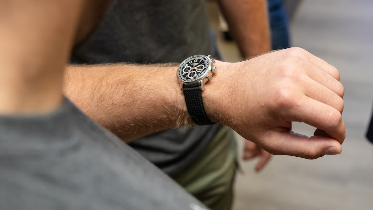 MMA champ Dricus du Plessis models a Chopard Mille Miglia Classic Chronograph; Banxso will be giving away three of these designer timepieces as part of the Tour de Banxso.