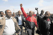 Julius Malema arrives to address the striking mine workers at Lonmil mine in North West.
