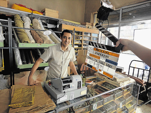 Riaad Moosa in a Fordsburg fabric shop where scenes from the film 'Material' were shot Picture: SUPPLIED