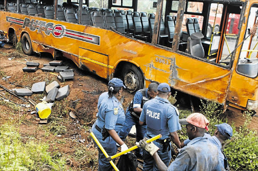 Police and emergency workers on the scene of one of the increasing number of fatal bus accidents happening around the country Picture: LEBOHANG MASHILOANE