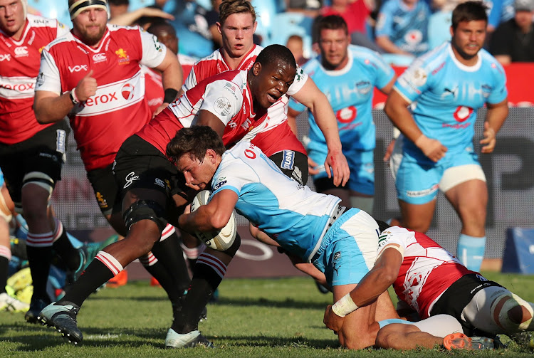 JT Jackson of the Bulls is tackled by Hacjivah Dayimani of the Lions during the Currie Cup match between Blue Bulls and Golden Lions at the Loftus Versveld Stadium, Pretoria on September 1 2018.