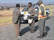 CAUGHT OUT: 
      Bapong traffic station boss Monica Madiba is seen   wearing slippers with her uniform during office hours.
