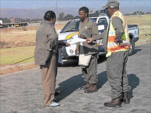 CAUGHT OUT: Bapong traffic station boss Monica Madiba is seen wearing slippers with her uniform during office hours.