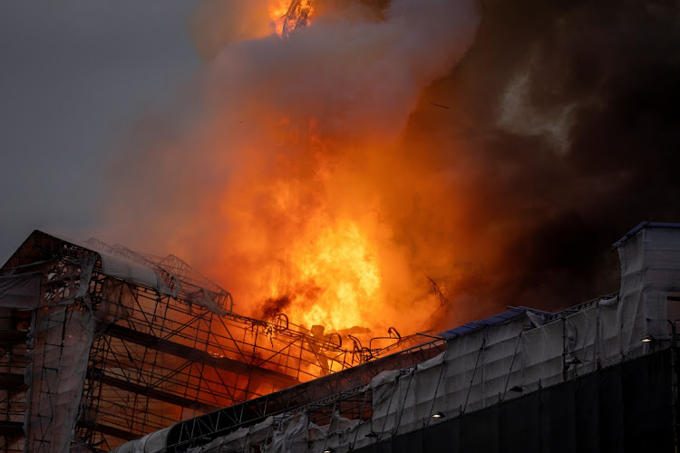 Fire burns at the Old Stock Exchange, Boersen, in Copenhagen, Denmark, April 16 2024. Picture: Ritzau Scanpix/Ida Marie Odgaard/REUTERS