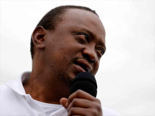 President Uhuru Kenyatta addresses his supporters at Burma market after his election win was declared invalid by the Supreme Court in Nairobi, Kenya, September 1, 2017. /REUTERS