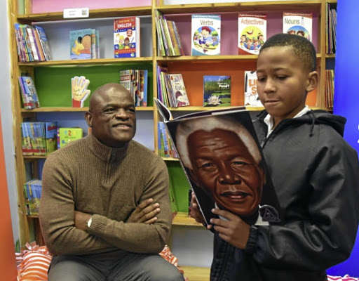 Premier Zamani Saul handed over a library at his alma mater during Mandela Day at Visisani Primary School in Petrusville.