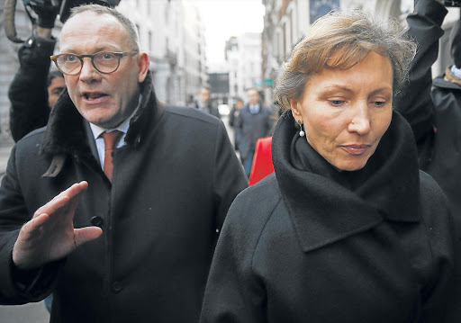 Marina Litvinenko, widow of murdered KGB agent Alexander Litvinenko is surrounded by cameras as she makes her way back to the High Court in central London.