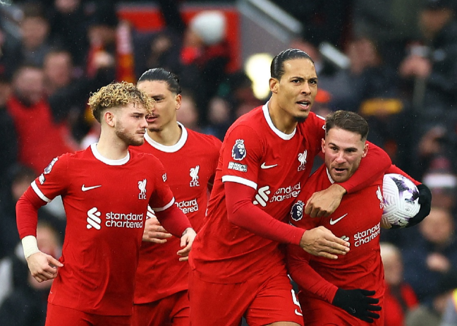 Alexis Mac Allister celebrates scoring Liverpool's goal with Virgil van Dijk in their Premier League draw against Manchester City at Anfield in Liverpool on Sunday.