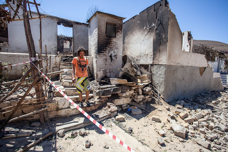 Wupperthal resident Franklin Samson walks down the steps of one of the 53 homes that were destroyed. Photo taken January 1 2019