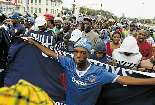 UNITED WE STAND: Chippa United supporters with other clubs’ supporters march to the East London City Hall to protest against the move to stop Chippa’s games in East London Picture: MICHAEL PINYANA