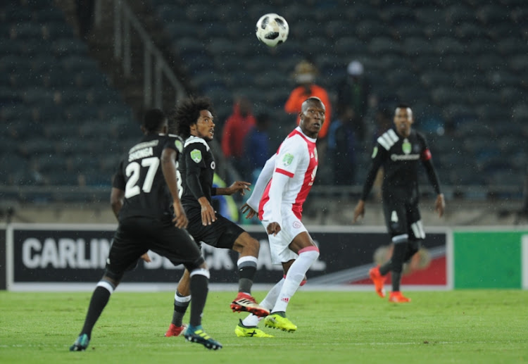Issa Sarr and Justin Shonga of pirates in action with Tendai Ndoro of Ajax during the Nedbank Cup Last 32 match between Orlando Pirates and Ajax Cape Town at Orlando Stadium on February 10, 2018 in Johannesburg, South Africa.