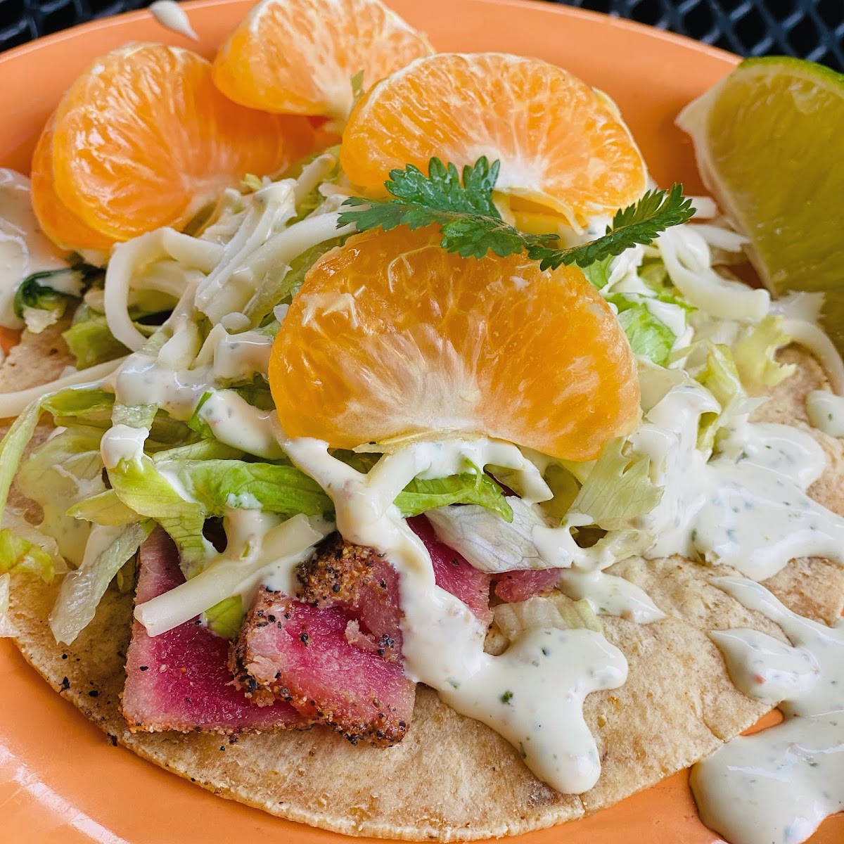 Pacific Rim Fish Taco.  Ahi tuna seared to perfection (can be cooked any preference) served on a GF corn tortilla.