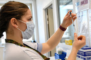 A healthcare worker prepares a dose of a Covid-19 vaccine at a vaccination centre in the HIA Begin military hospital, in Saint-Mande, southeast of Paris, France on March 7 2021. 