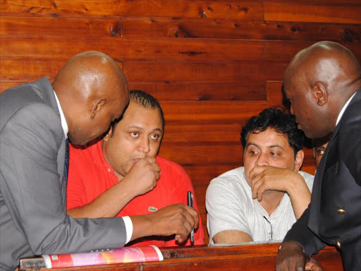 Baktash Akasha and Ibrahim Akasha with lawyers Gikandi Nguibuini (left) and Cliff Ombeta at Mombasa law court, 2014. /FILE