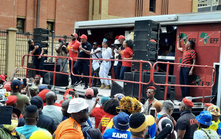 EFF leader Julius Malema addresses supporters outside the Pretoria offices of sports minister Nathi Mthethwa on Thursday.