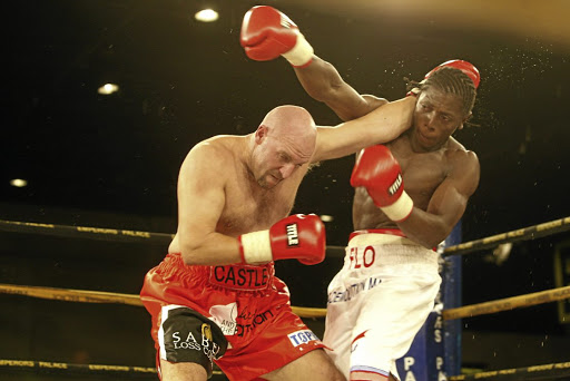 Stephen Castle, left, exchanges blows with Flo Simba during their heavyweight clash at Emperors Palace.