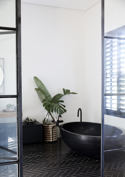 The black Dado bath in the master bathroom is a beauty and a definite focal point!