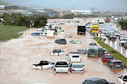 TRAPPED  Cars semi-submerged  on Prospecton Road, south of Durban, on Tuesday 