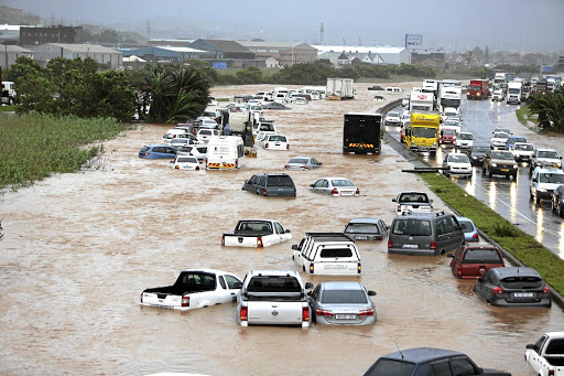 TRAPPED Cars semi-submerged on Prospecton Road, south of Durban, on Tuesday