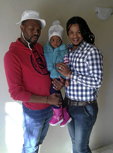 Sbusiso, left, and Sabelo Makhanya and their beautiful daughter, Ndalo