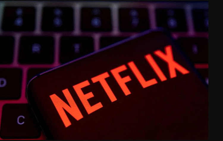 Smartphone with Netflix logo is placed on a keyboard in this illustration taken April 19, 2022.