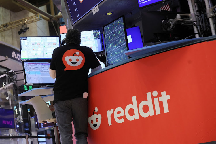 A trader in a Reddit t-shirt at the New York Stock Exchange in New York, the US, March 21 2024. Picture: REUTERS/BRENDAN MCDERMID