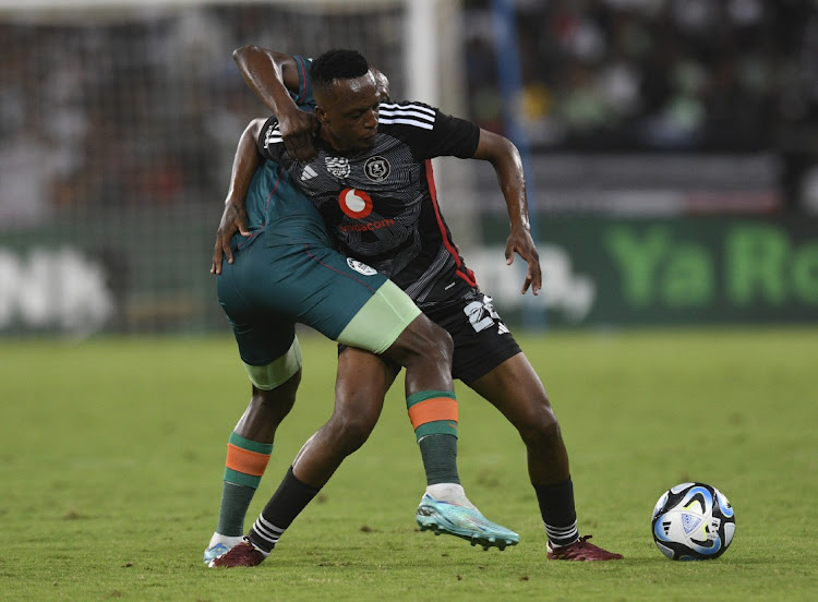 Ben Motshwari of AmaZulu challenges Patrick Maswanganyi of Pirates during their Nedbank Cup quaterfinal match on Saturday.