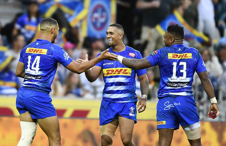 Suleiman Hartzenberg of the Stormers celebrate with teammates after he scored a try during their United Rugby Championship (URC) match against Edinburgh at DHL Stadium.