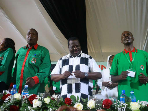 Knut Treasurer John Matiang'i with outgoing chairman Mudzo Nzili and Knut Secretary General Wilson Sossion during the 60th annual delegates conference at wild waters complex in Mombasa, December 14, 2017. /JOHN CHESOLI