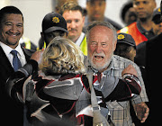 Prof Cyril Karabus and his wife Jennifer about to embrace at Cape Town International Airport on his arrival from the UAE, where he had been detained. File photo