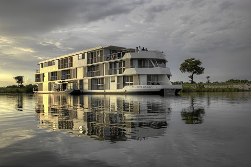 The Zambezi Queen sails down the Chobe River.